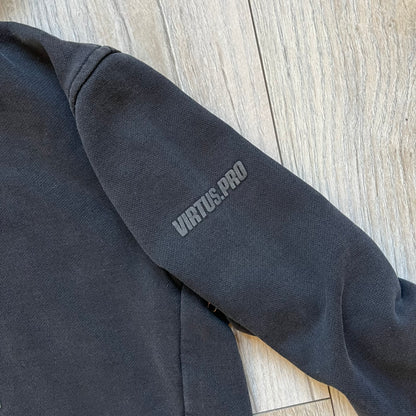 Virtus Pro 2020s Washed Black Hoodie is a black pullover hoodie featuring the Virtus.Pro logo on the front. Made from soft, high-quality materials, it offers a comfortable fit with durability suitable for casual wear or gaming. This hoodie was released in the 2020s as official Virtus.Pro esports merchandise.