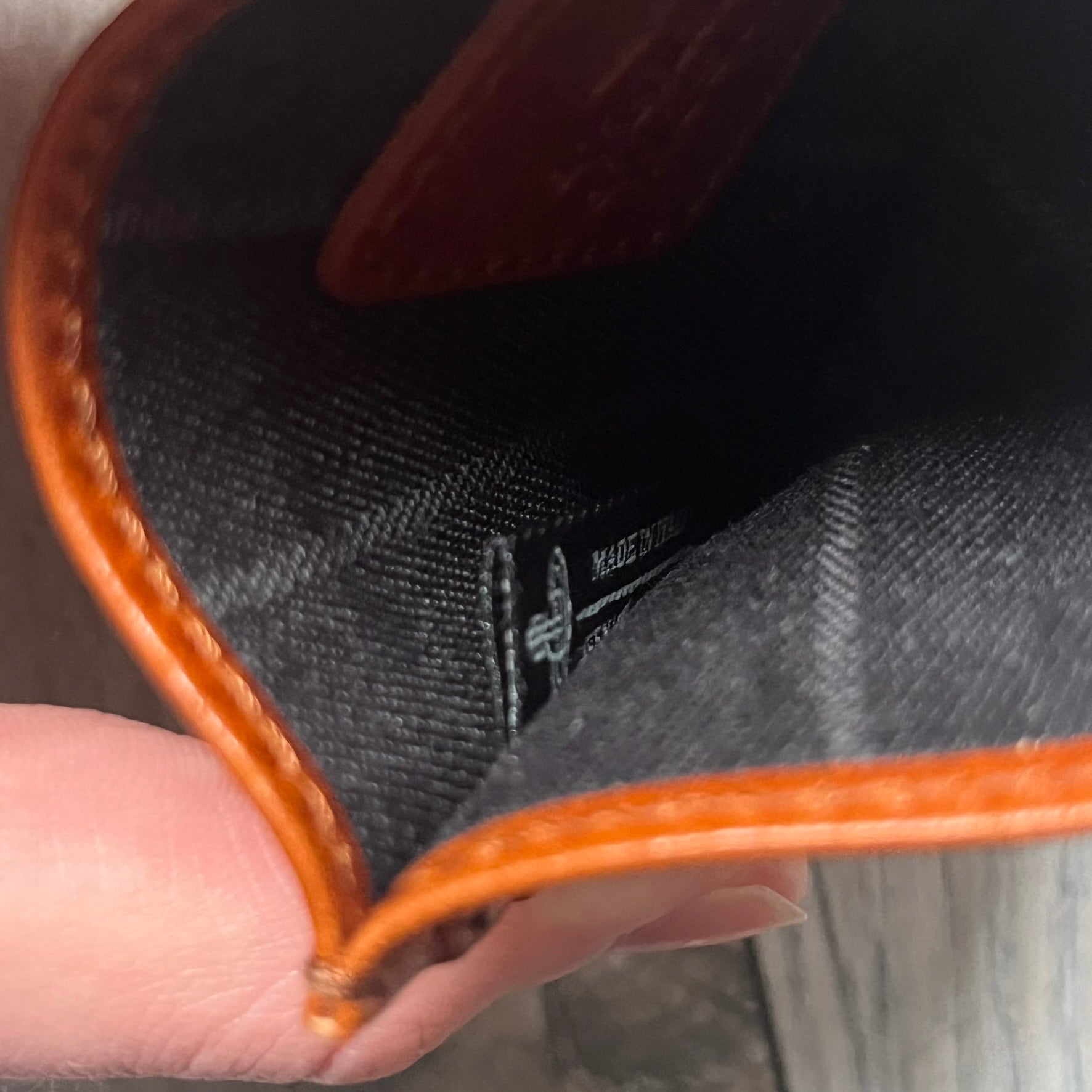 Vivienne Westwood Brown Flat Card Holder is crafted from buffed leather in a camel brown tone with logo hardware at the front. It features four card slots, a central note compartment, black twill lining, and an interior leather Vivienne Westwood tab with a material tag. Made in Italy, the card holder comes with the original box and tags. 252314M163098