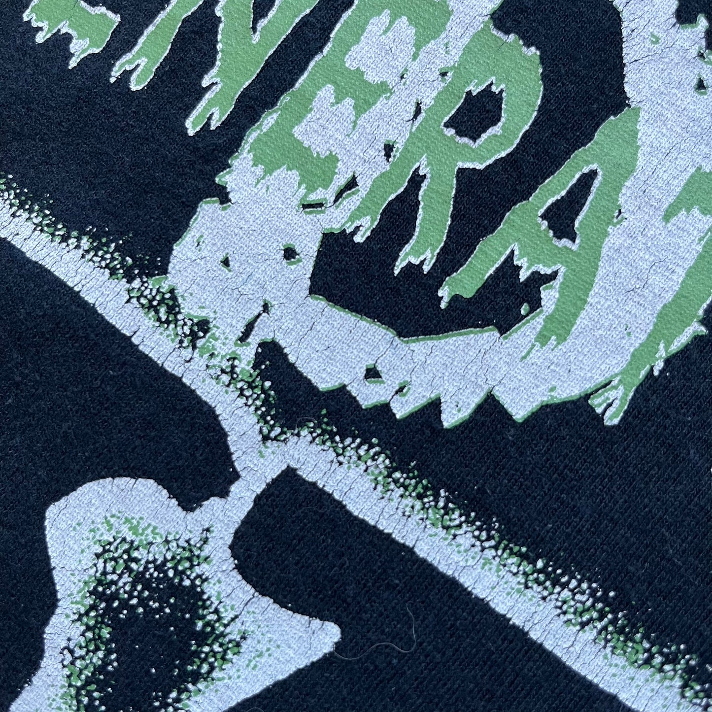 WWE D-Generation X 2000s Black Tee is a black short-sleeve T-shirt made on a Gildan blank in the early 2000s. The front features a D-Generation X logo with a large black “X” outlined in white glow and subtle green, topped with white “D” and green “Generation” text. This shirt was released as official WWE merchandise during the 2000s.