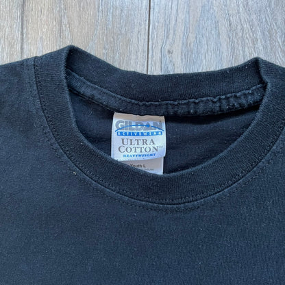 WWE D-Generation X 2000s Black Tee is a black short-sleeve T-shirt made on a Gildan blank in the early 2000s. The front features a D-Generation X logo with a large black “X” outlined in white glow and subtle green, topped with white “D” and green “Generation” text. This shirt was released as official WWE merchandise during the 2000s.