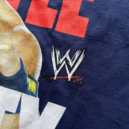 WWE John Cena “Hustle Loyalty Respect” Tee in navy, printed on a classic Screen Stars blank. Features a large front graphic of John Cena with big red, white, and blue lettering behind / in front of him and the WWE logo beside. A staple piece from Cena’s prime wrestling era.