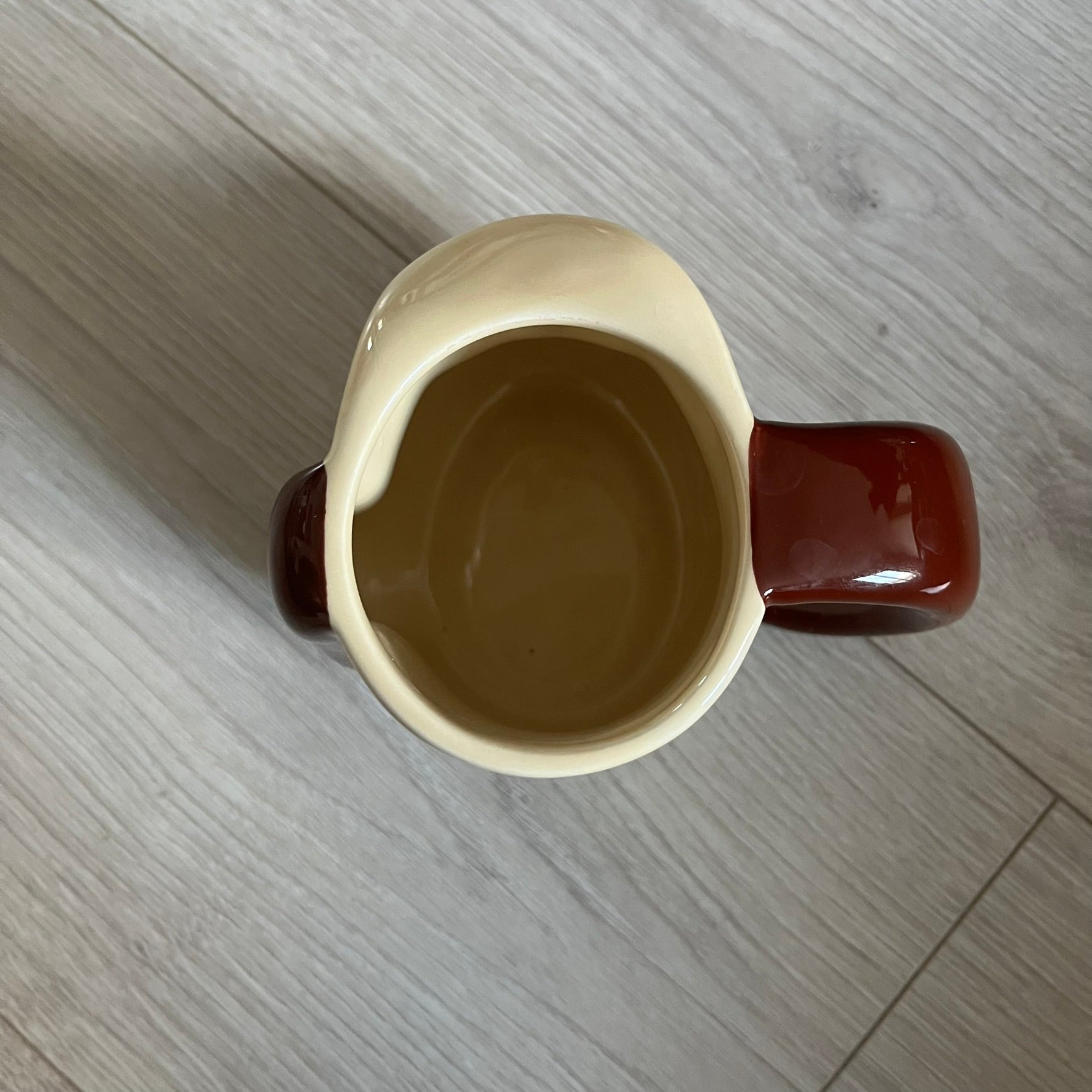 This 2005 Wallace &amp; Gromit ceramic mug captures the beloved character in full 3D detail, with protruding eyes and nose and an irregular sculpted form. One ear doubles as the handle, adding playful functionality to the design. Created exclusively for PG Tips, it’s finished with official licensing and copyright on the base.