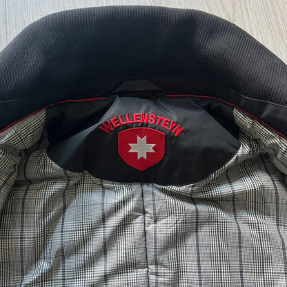 The Wellensteyn Mercury Black Winter Jacket combines premium function with tailored elegance. Crafted from TiSaAirTec fabric, it offers a smooth, matte finish that is waterproof, windproof, and built for temperatures from 0 to -20 °C. Features include a removable inner jacket with a high knit collar, multiple secure pockets, back vents, and a quilted lining for warmth. A signature of German engineering and timeless outerwear design.