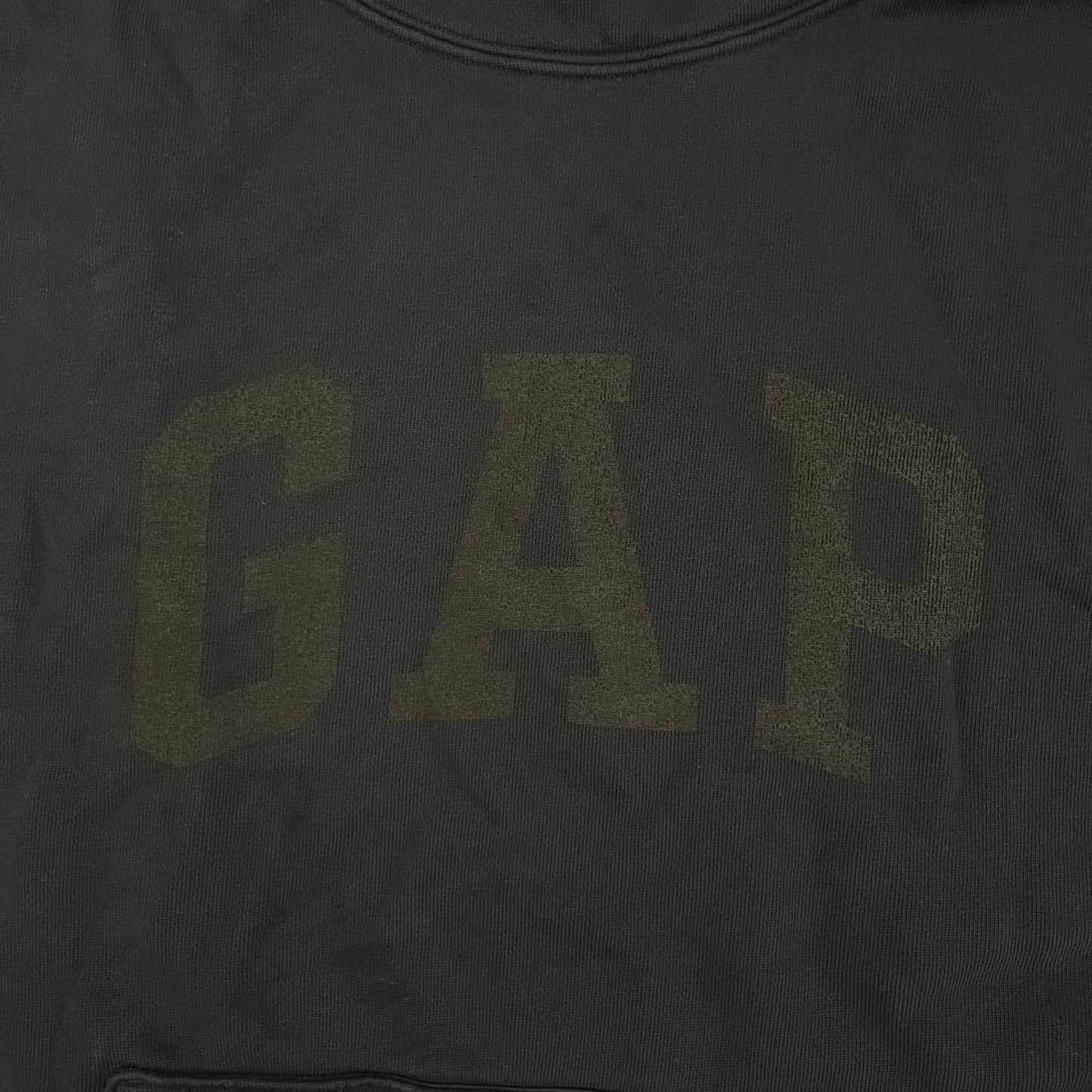 Yeezy GAP Engineered by Balenciaga Dove Hoodie in washed black, produced as part of the three-way Yeezy, GAP, and Balenciaga collaboration. Features a boxy, oversized fit with a slightly darker oversized GAP logo printed on the front and a large white dove graphic on the back. Each hoodie shows natural variation in wash, tone, and texture, consistent with the production process used for this release, from LosAngelesArchive.