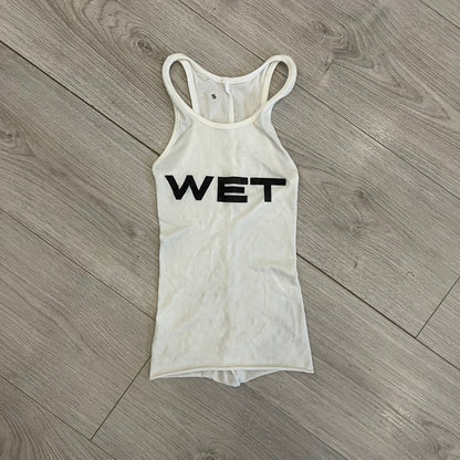 Yeezy x Mowalola WET Tank Top in white cotton with the big black “WET” graphic across the chest. The fabric is highly stretchy, giving it a flexible and sculpted fit.