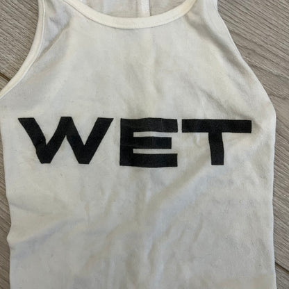 Yeezy x Mowalola WET Tank Top in white cotton with the big black “WET” graphic across the chest. The fabric is highly stretchy, giving it a flexible and sculpted fit.