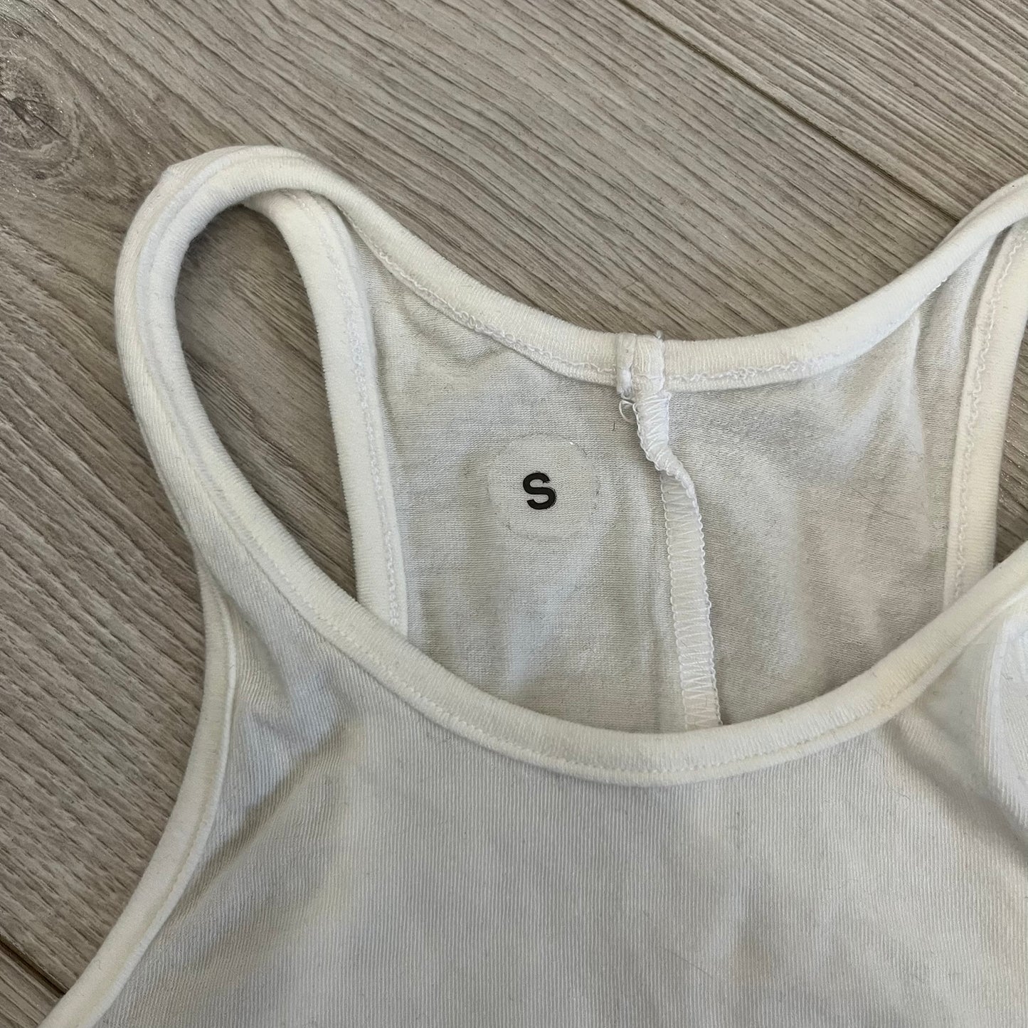 Yeezy x Mowalola WET Tank Top in white cotton with the big black “WET” graphic across the chest. The fabric is highly stretchy, giving it a flexible and sculpted fit.