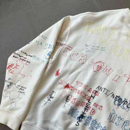 Yeezy Season 5 Scribbled Adidas Crewneck by ERD features an oversized, boxy silhouette in the Arctic colorway. The 100% cotton Adidas crewneck has handwritten-style printed graphics and phrases across the garment, including a embroidered Adidas Three Stripes logo on the chest. It was made in Italy and designed by Henri Alexander Levy from Enfants Riches Déprimés.