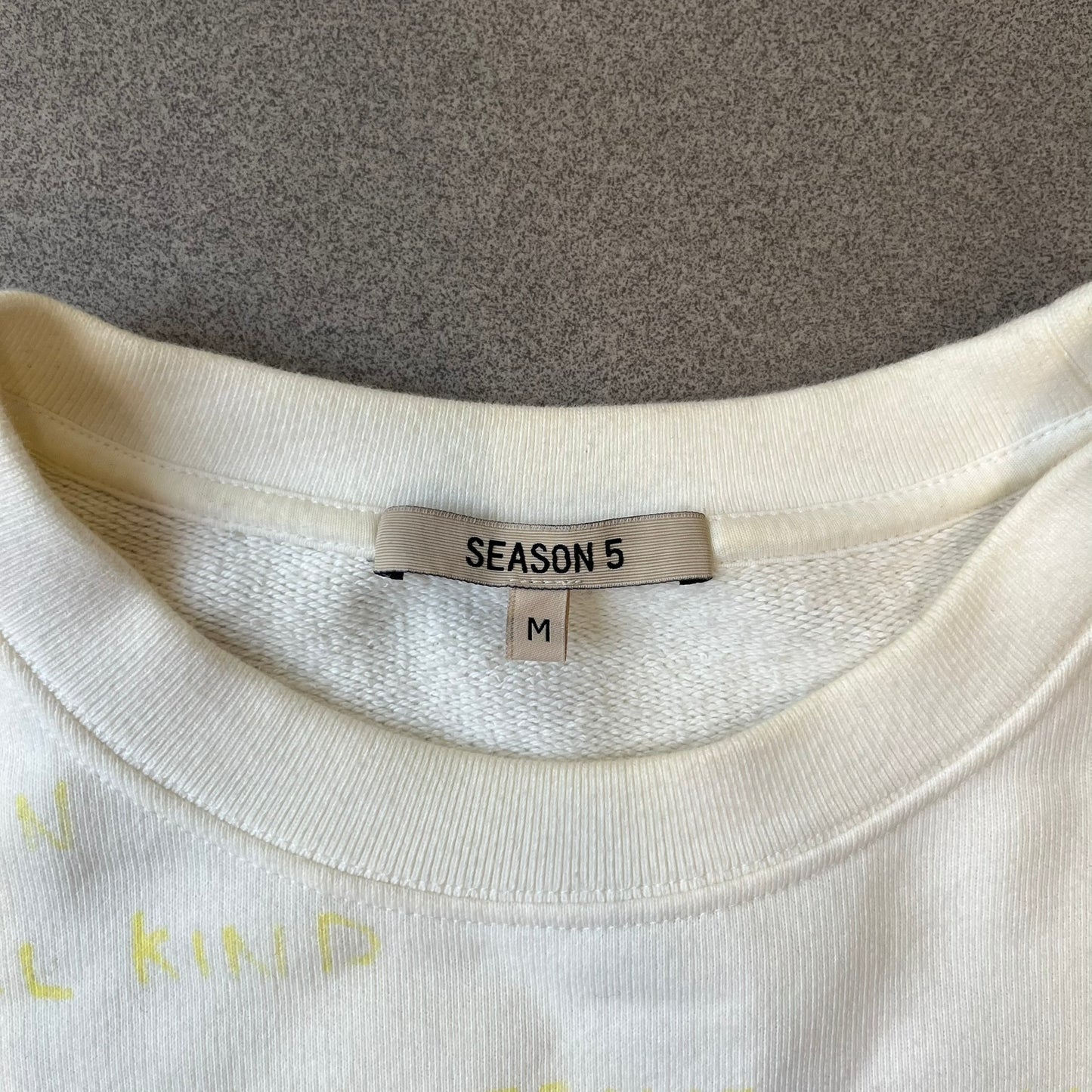 Yeezy Season 5 Scribbled Adidas Crewneck by ERD features an oversized, boxy silhouette in the Arctic colorway. The 100% cotton Adidas crewneck has handwritten-style printed graphics and phrases across the garment, including a embroidered Adidas Three Stripes logo on the chest. It was made in Italy and designed by Henri Alexander Levy from Enfants Riches Déprimés.