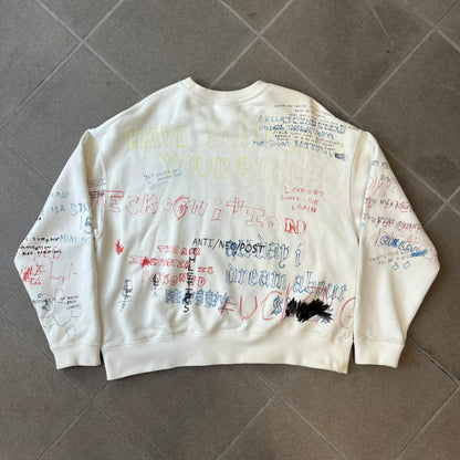 Yeezy Season 5 Scribbled Adidas Crewneck by ERD features an oversized, boxy silhouette in the Arctic colorway. The 100% cotton Adidas crewneck has handwritten-style printed graphics and phrases across the garment, including a embroidered Adidas Three Stripes logo on the chest. It was made in Italy and designed by Henri Alexander Levy from Enfants Riches Déprimés.