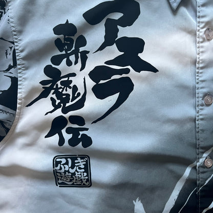 White shirt with black Japanese text and logo on a light gray background
