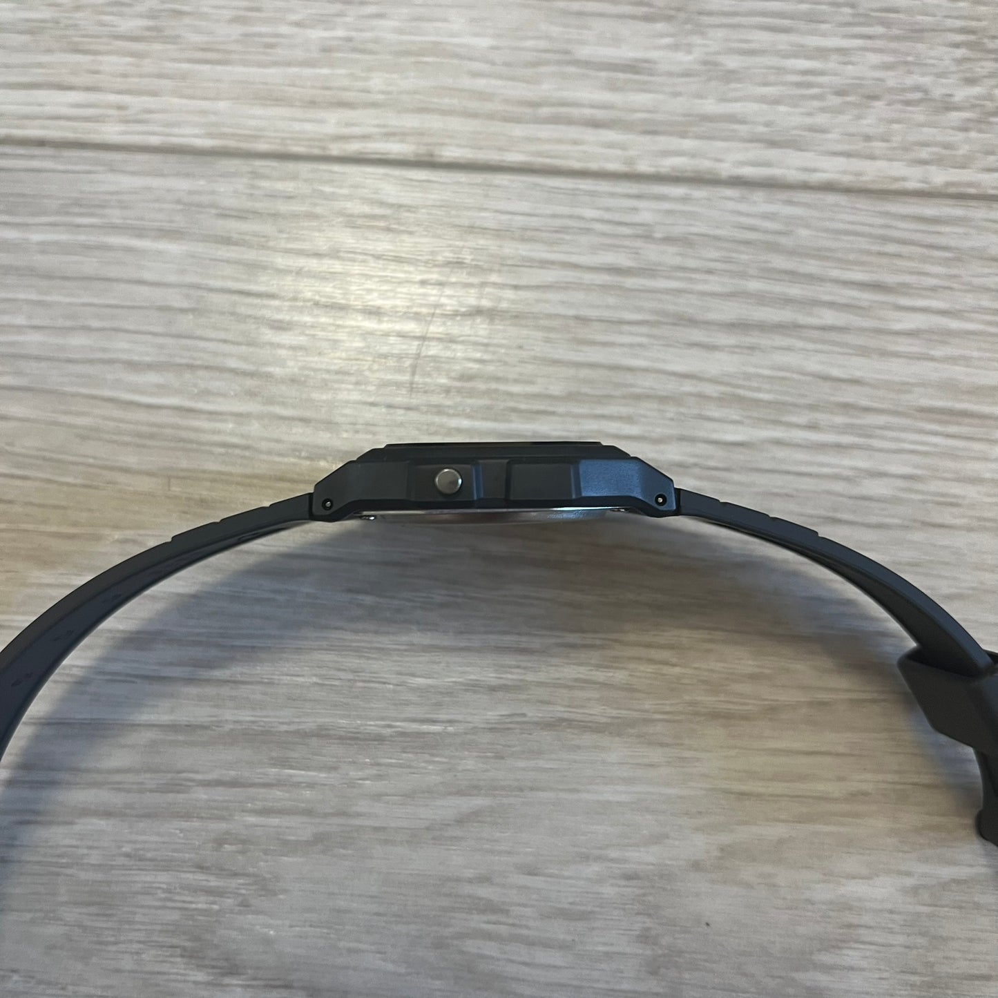 Black dog collar on a wooden surface