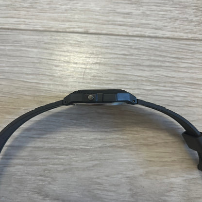 Black dog collar on a wooden surface