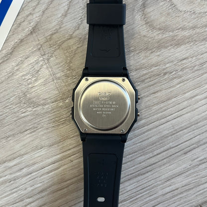 Back view of a Casio watch on a wooden surface