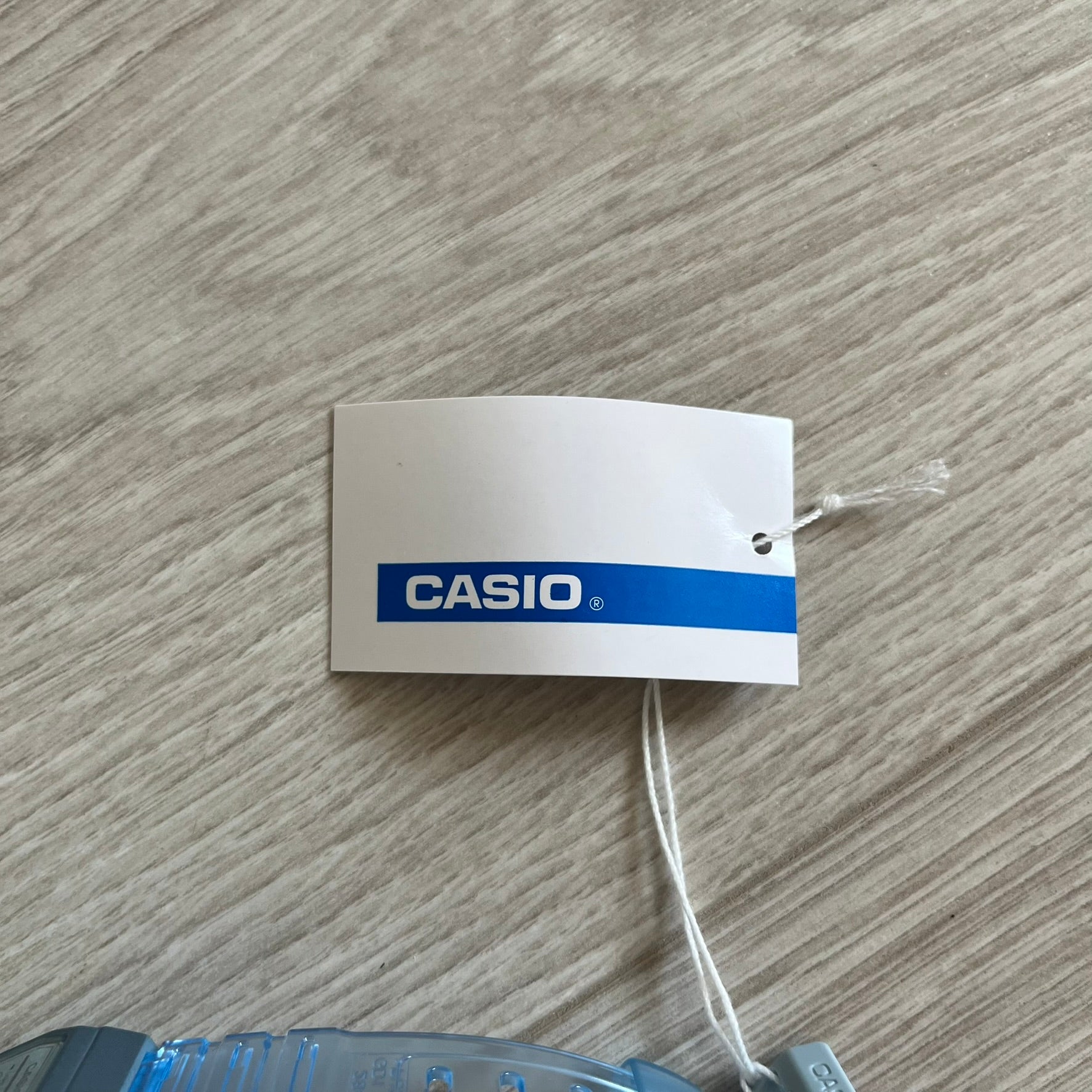 Casio tag on a wooden surface