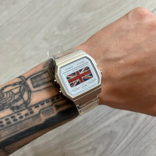 Casio watch with British flag design on a wrist with tattoos