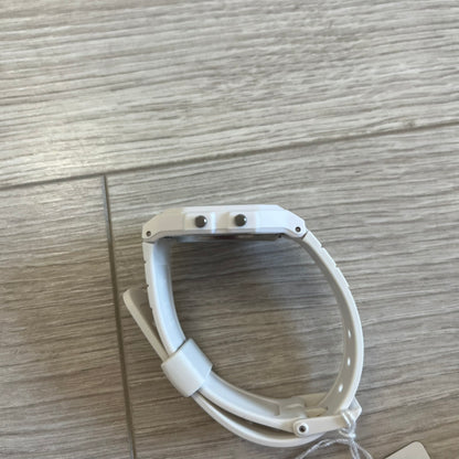 White plastic ring on a wooden surface