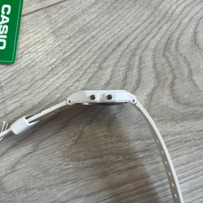 White Casio watch band on a wooden surface