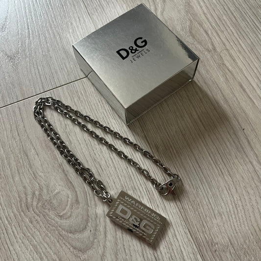 D&G jewelry box with chain on a wooden surface