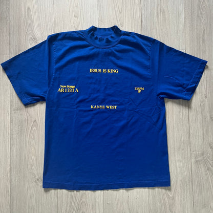 Blue t-shirt with text on a wooden surface