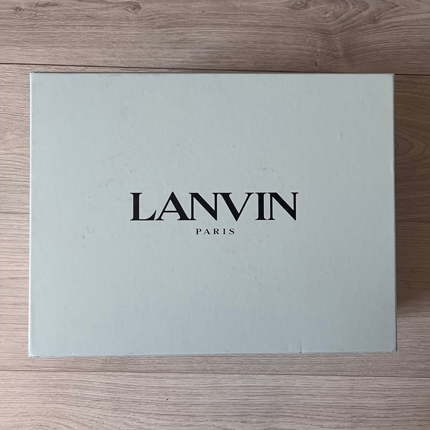 Lanvin Paris box on a wooden surface