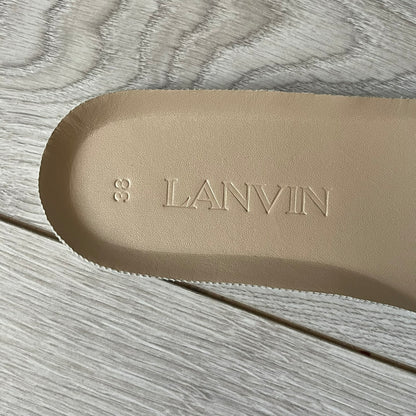 Beige insole with 'LANVIN' branding on a wooden surface