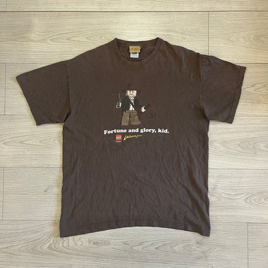 Brown t-shirt with a graphic design on a wooden floor
