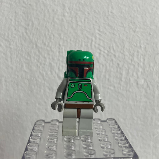 LEGO minifigure on a clear baseplate against a white wall