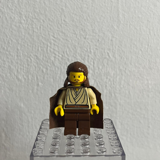 LEGO minifigure on a clear baseplate against a white background