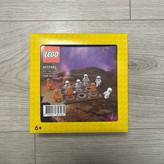 LEGO Tic Tac Toe set packaging on a wooden surface