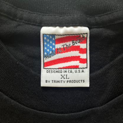Black shirt with a label featuring an American flag and text