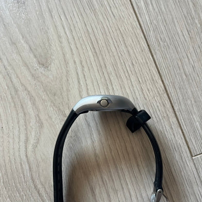 Black and silver bridle on a wooden floor