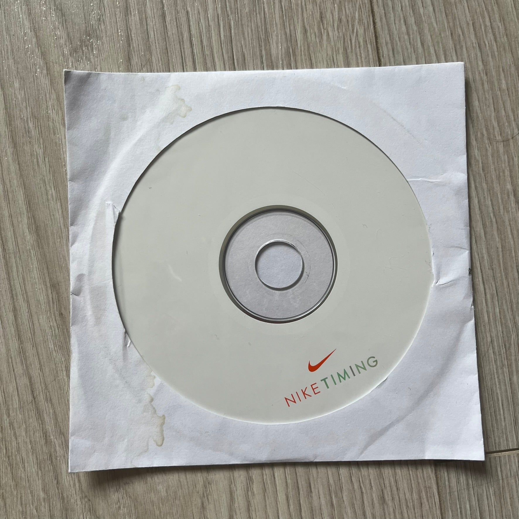 Nike Timing CD on a white paper background