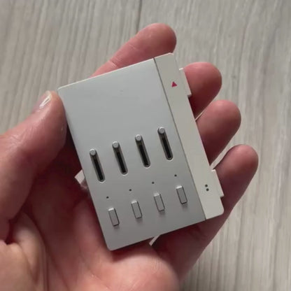 Teenage Engineering YZY 2019 OG Stem Player, an unreleased collaboration between Kanye West and Teenage Engineering. This rare device allows you to isolate stems like vocals, drums, and bass while adding effects such as filters, echo, and distortion. Featuring a sleek, minimalist metal design and ergonomic build, it was first seen during Kanye’s 2019 Sunday Service era and came paired with exclusive extended versions of “Jesus Is King.” Fully compatible with headphones and speakers, it remains a sought-afte