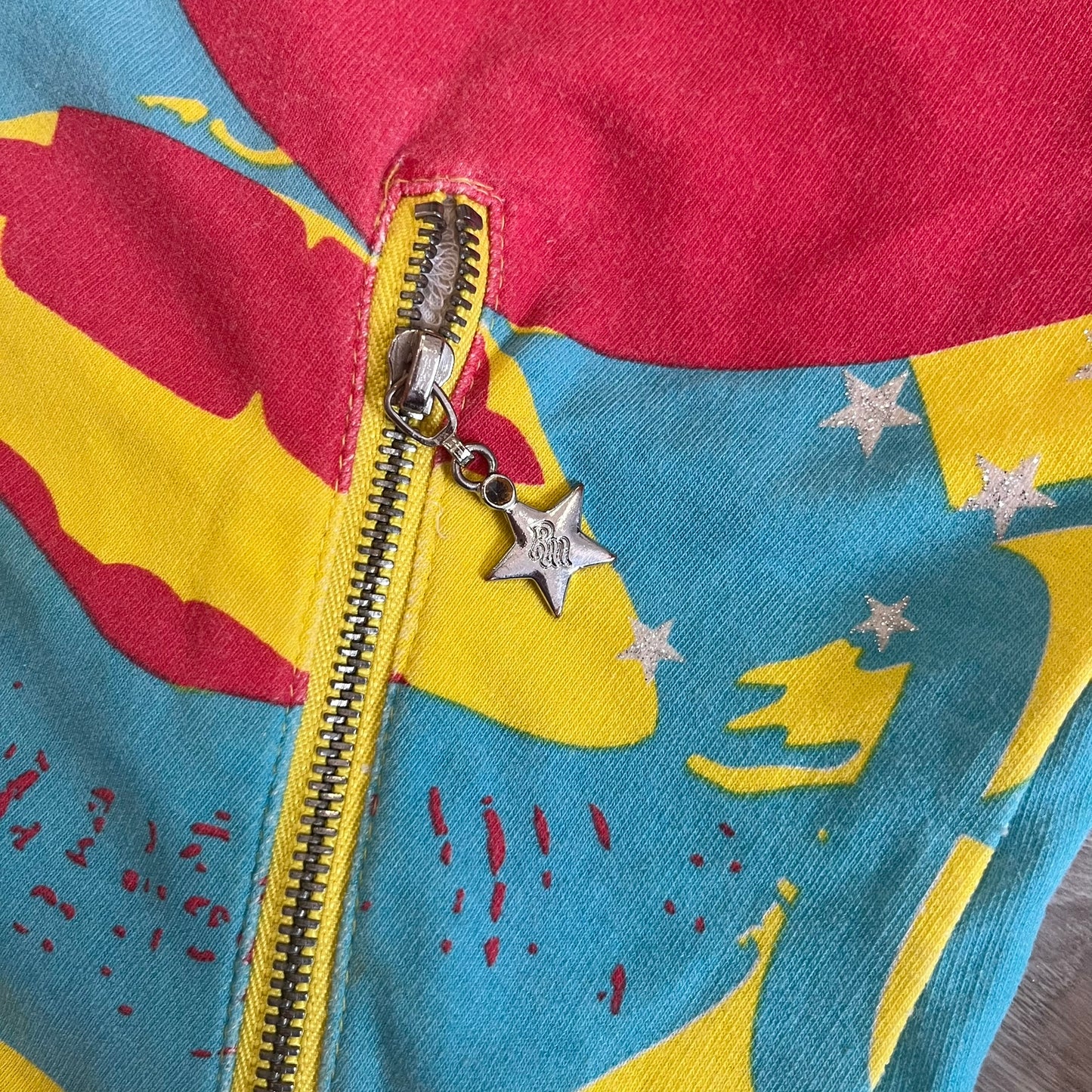 Colorful fabric with a zipper and star-shaped charm
