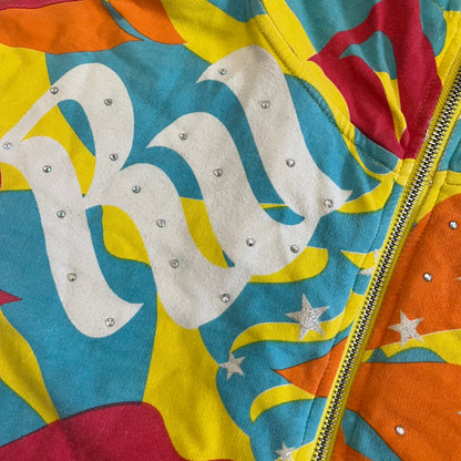 Colorful jacket with a prominent brand logo and decorative elements.