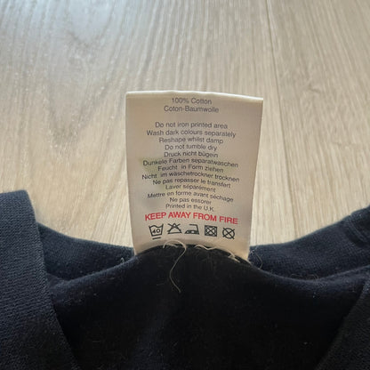 Clothing label on a dark fabric background