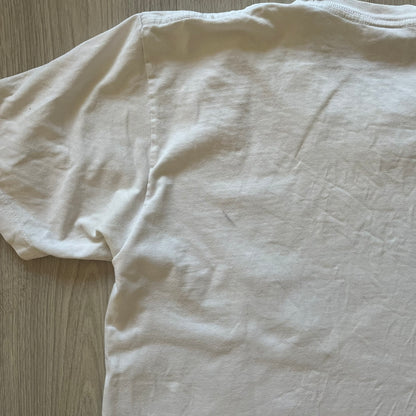 White t-shirt on a wooden surface