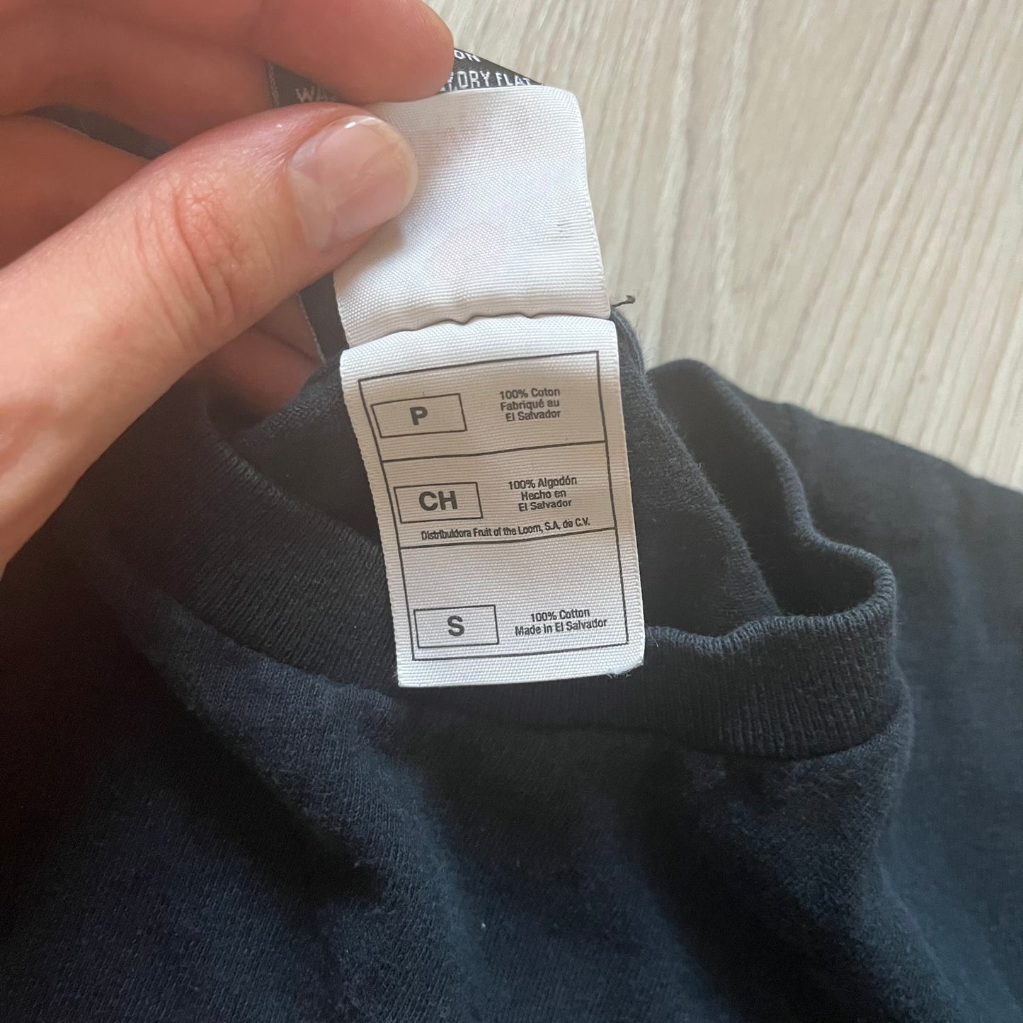 Clothing label on a dark fabric background