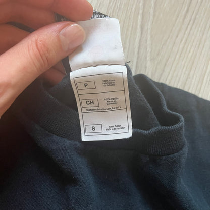 Clothing label on a dark fabric background